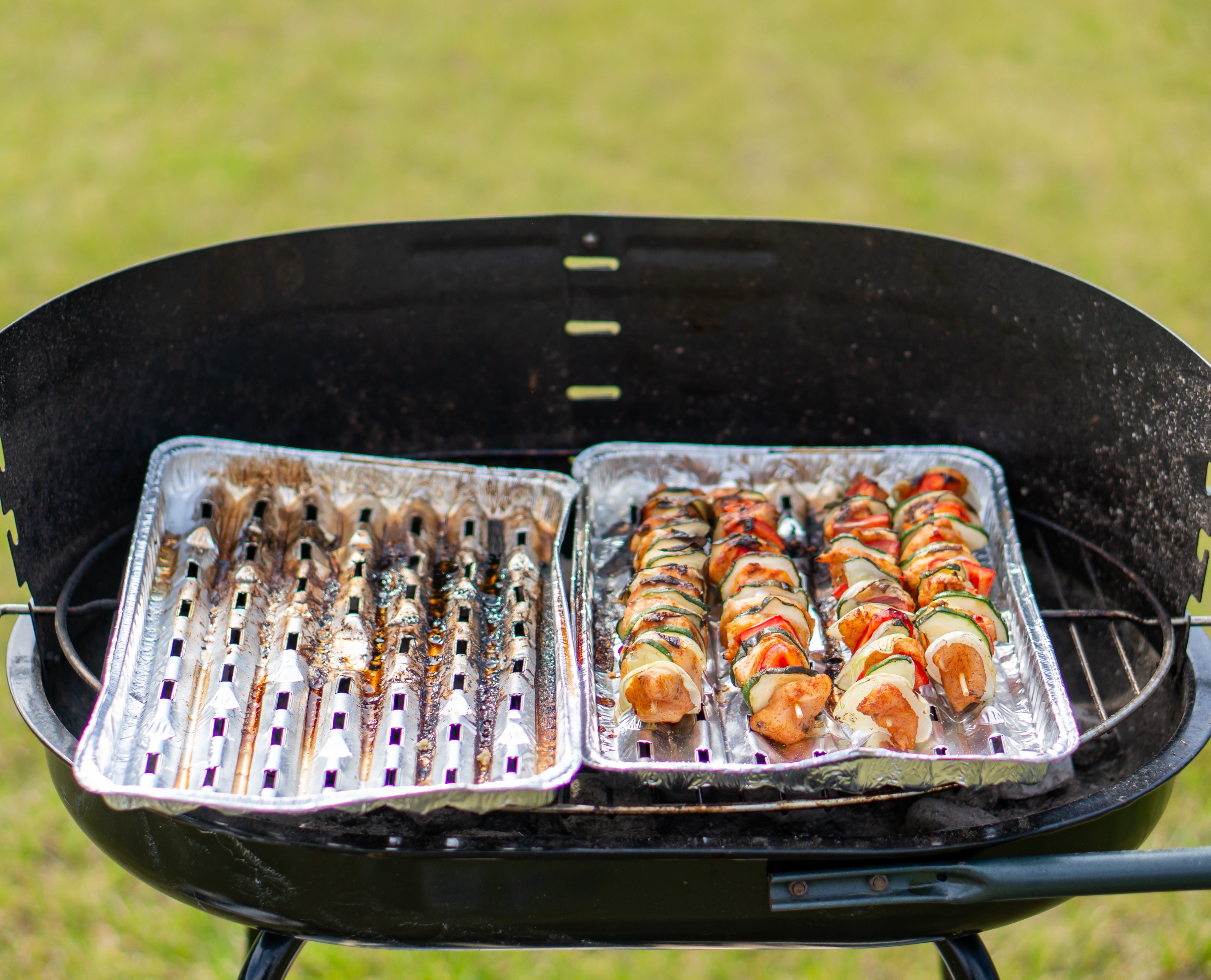 Chicken meat and vegetables in a stick on a barbecue grill