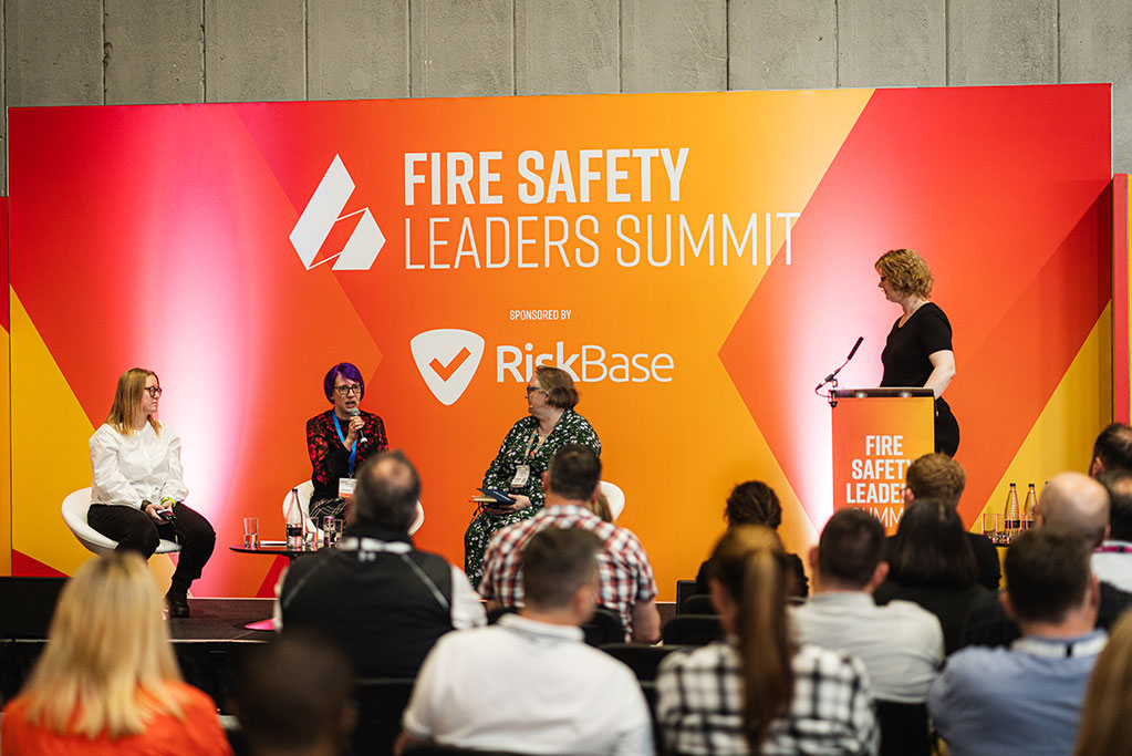 women talking fire on stage